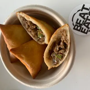 Phili cheese triangles. Sooo good . Beat Eats crew were sampling this out . It's  so good.