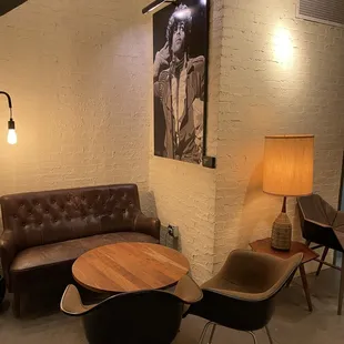 a living room with a couch, table and chairs