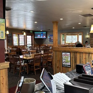a dining area with tables and chairs