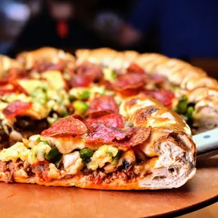 a slice of pizza on a cutting board