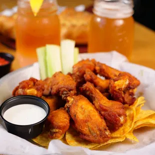 a plate of chicken wings and chips