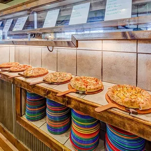 a row of pizzas