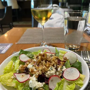 Farmer's Salad: mixed field greens, roasted pumpkin seeds, beets, goat cheese and a sherry vinaigrette and a local Chardonnay.