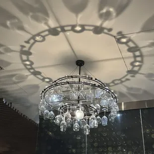 a chandelier made of wine glasses