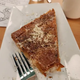 a slice of pizza and a fork
