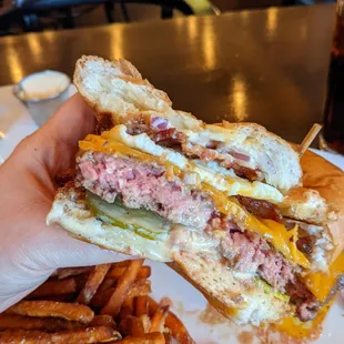 Medium-rare Brunch burger with bacon slab, runny egg, and perfect pickles. So good.