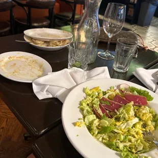 Dirty table that nobody cleared for hours. Ahi Tuna was fishy and inedible.   Waiter abandoned us for hours.