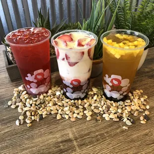 three different drinks on a table