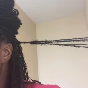 A chunk of locks she grabbed and Palm rolled. She was supposed to separate each one and interlock them.