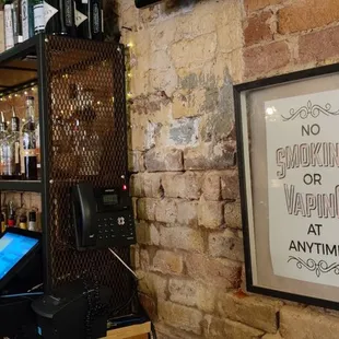 a bar with a brick wall