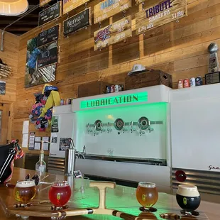 a bar with beer glasses