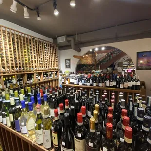 a large selection of wine bottles