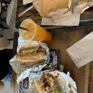 Bottom to top: Korean Chicken Steak and Cheese, Bulgogi Sub, Tropical Fruit tea, Bulgogi Fries