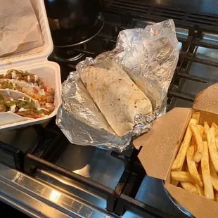 Takeout order- Mexican chicken tacos, carne Burrito, Mexican fries