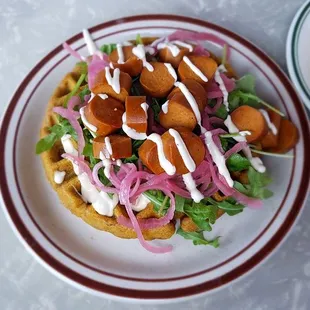 Sweet potato waffle with vegan sausage (center) + cornbread waffle (top right corner).