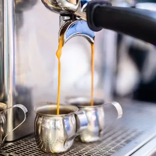 coffee being poured into a cup