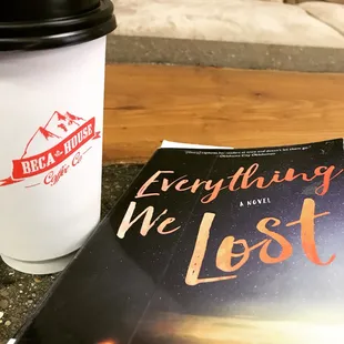 Celebrating with a triple soy latte and a library book