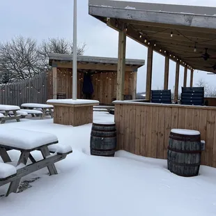 snow covered picnic tables