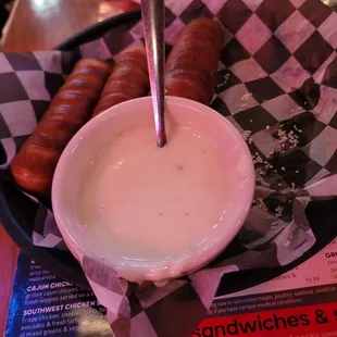 a bowl of soup and hot dogs