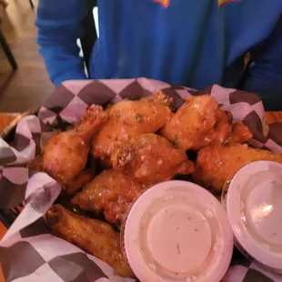 a basket of fried chicken wings