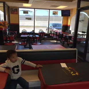 Dining area has custom table covers.