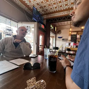 two men sitting at a table
