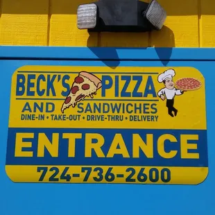 Sign at the side door entrance.