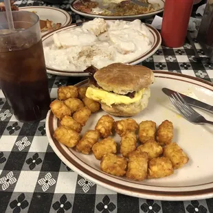 Bacon, egg and cheese biscuit with tots.  Biscuits and gravy in the middle.