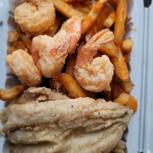 Lunch special. Shrimps, fries and fish