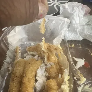 a hand holding a fork