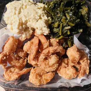 Fried shrimp with potato salad and collard greens