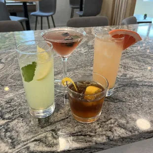 three cocktails on a table