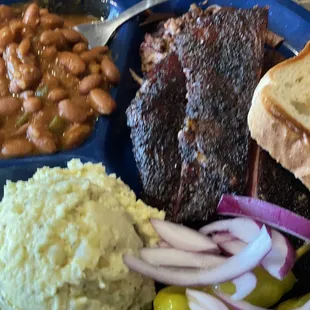 Two meat combo meal with ribs, sliced brisket, potato salad and cowboy beans