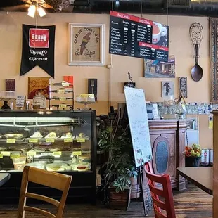 Welcoming space with some tasty pastries at the counter.