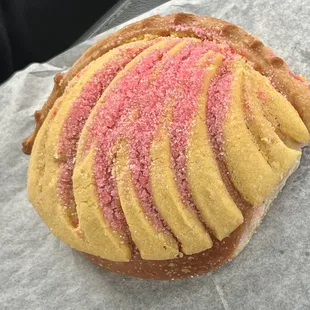 a pink and yellow pastry