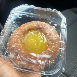 Lemon filled glazed donut