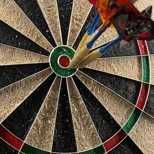 a dart in the center of a dartboard