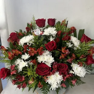 Funeral arrangement red flowers and white flowers