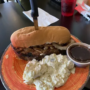 Ribeye steak sandwich with potato salad