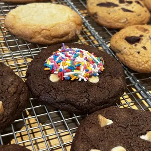 Chocolate Birthday Cake! Double chocolate cookie w/ confetti chips, vanilla frosting &amp; rainbow sprinkles.