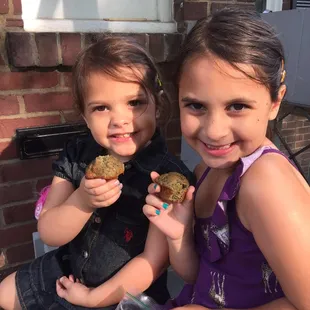 Kale smoothie brownies from the market.  The girls approve. "Yummy"!!