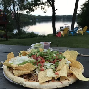 Taco pizza and a view of the lake from our favorite table