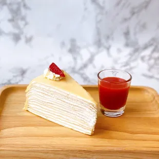 Original crepe cake with strawberry sauce.