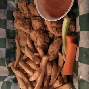 a basket of fried chicken and fries