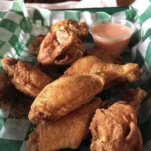 a basket of fried chicken wings