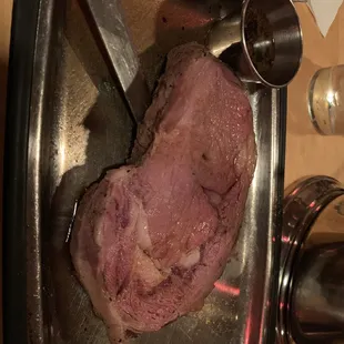 a piece of meat in a pan