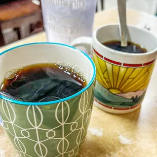 two cups of coffee on a table