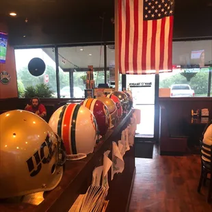 lmets lined up on a bar