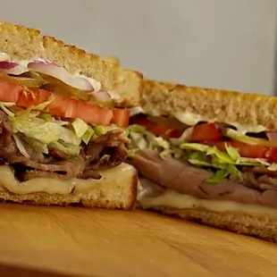 The Watterson. Premium roast beef served on grilled rye with swiss cheese and all the fixings