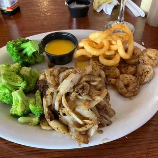Surf and turf with broccoli and grilled onions. Ignore the curly fries I stole off my Dad's plate.